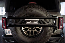 Load image into Gallery viewer, DV8 Offroad 21-23 Ford Bronco Spare Tire Guard & Accessory Mount - Additional View 13