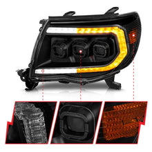 Load image into Gallery viewer, ANZO 05-11 Toyota Tacoma Full LED Proj Headlights White DRL/Init/SeqSig Black - Pair - Installation View