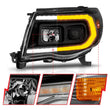 Load image into Gallery viewer, ANZO 05-11 Toyota Tacoma Projector Headlights w/Light Bar Switchback Black Housing - Additional View 7