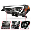 Load image into Gallery viewer, ANZO 14-18 Toyota 4 Runner Plank Style Projector Headlights Black w/ Amber - Side View