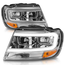 Load image into Gallery viewer, ANZO 1999-2004 Jeep Grand Cherokee Crystal Headlights w/ Light Bar Chrome Housing - Installation View