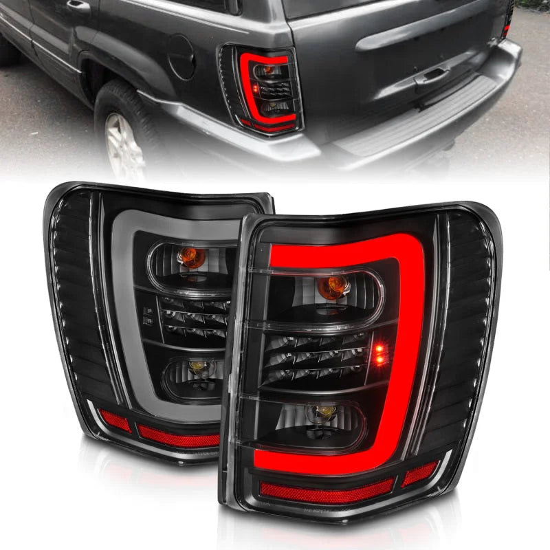 ANZO 1999-2004 Jeep Grand Cherokee LED Tail Lights w/ Light Bar Black Housing Clear Lens - Main Product View