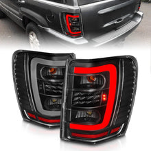 Load image into Gallery viewer, ANZO 1999-2004 Jeep Grand Cherokee LED Tail Lights w/ Light Bar Black Housing Clear Lens - Main Product View
