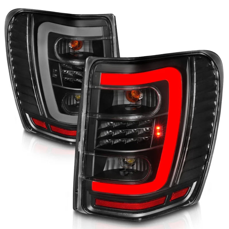 ANZO 1999-2004 Jeep Grand Cherokee LED Tail Lights w/ Light Bar Black Housing Clear Lens - Side View