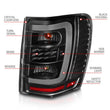 Load image into Gallery viewer, ANZO 1999-2004 Jeep Grand Cherokee LED Tail Lights w/ Light Bar Black Housing Clear Lens - Back View