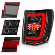 Load image into Gallery viewer, ANZO 1999-2004 Jeep Grand Cherokee LED Tail Lights w/ Light Bar Black Housing Clear Lens - Additional View 7