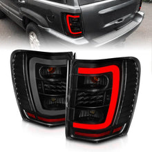 Load image into Gallery viewer, ANZO 1999-2004 Jeep Grand Cherokee LED Tail Lights w/ Light Bar Black Housing Smoke Lens - Main Product View