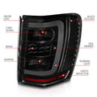 Load image into Gallery viewer, ANZO 1999-2004 Jeep Grand Cherokee LED Tail Lights w/ Light Bar Black Housing Smoke Lens - Installation View