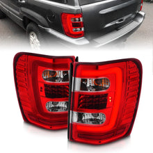 Load image into Gallery viewer, ANZO 1999-2004 Jeep Grand Cherokee LED Tail Lights w/ Light Bar Chrome Housing Red/Clear Lens - Main Product View