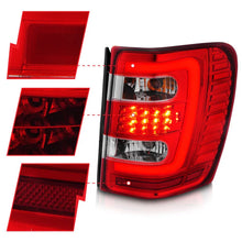 Load image into Gallery viewer, ANZO 1999-2004 Jeep Grand Cherokee LED Tail Lights w/ Light Bar Chrome Housing Red/Clear Lens - Back View