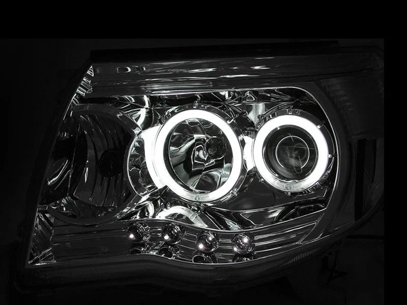 ANZO 2005-2011 Toyota Tacoma Projector Headlights w/ Halos Chrome - Side View