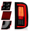 Load image into Gallery viewer, ANZO 2007-2013 Chevrolet Silverado1500/ 2500/ 3500 LED Tail Lights w/ Light Bar Black Housing Smoke - Back View