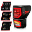 Load image into Gallery viewer, ANZO 2007-2013 Toyota Tundra LED Taillights Plank Style Black w/Clear Lens - Installation View