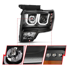 Load image into Gallery viewer, ANZO 2009-2014 Ford F-150 Projector Headlights w/ U-Bar Switchback Black w/ Amber - Installation View