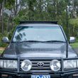 Load image into Gallery viewer, ARB Roof Rack Base with Mount Kit - Flat Rack with Wind Deflector - Back View