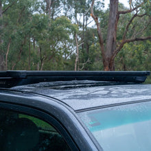 Load image into Gallery viewer, ARB Roof Rack Base with Mount Kit - Flat Rack with Wind Deflector - Installation View