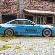 Load image into Gallery viewer, AST Suspension BMW M5 G99 Adjustable Lowering Springs - Back View