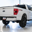 Load image into Gallery viewer, AWE 0FG 21+ Ford F150 Dual Side Exit Cat-Back Exhaust - 4.5in Diamond Black Tips - Back View