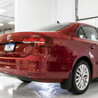 Load image into Gallery viewer, AWE Tuning 09-14 Volkswagen Jetta Mk6 1.4T Track Edition Exhaust - Chrome Silver Tips - Installation View