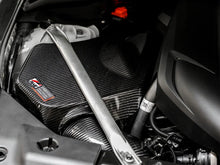 Load image into Gallery viewer, AWE Tuning 2020+ Toyota GR Supra S-FLO Carbon Intake Lid - Back View