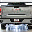 Load image into Gallery viewer, AWE Tuning 4th Gen GM 1500 5.3L 0FG Catback Dual Side Exit (Flat Bumper) - Chrome Tips - Installation View