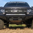 Load image into Gallery viewer, Addictive Desert Designs 10-14 Ford F-150 Raptor HoneyBadger Front Bumper w/ Winch Mount - Side View