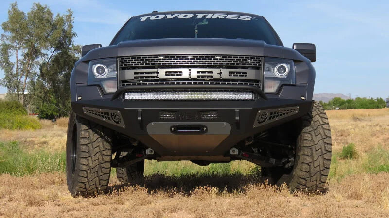 Addictive Desert Designs 10-14 Ford F-150 Raptor HoneyBadger Front Bumper w/ Winch Mount - Side View