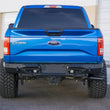 Load image into Gallery viewer, Addictive Desert Designs 15-18 Ford F-150 Stealth Fighter Rear Bumper w/ Backup Sensor Cutout - Installation View