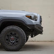 Load image into Gallery viewer, Addictive Desert Designs 16-18 Toyota Tacoma HoneyBadger Front Bumper - Side View