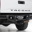 Load image into Gallery viewer, Addictive Desert Designs 16-19 Toyota Tacoma Stealth Fighter Rear Bumper w/ Backup Sensor Cutouts - Main Product View