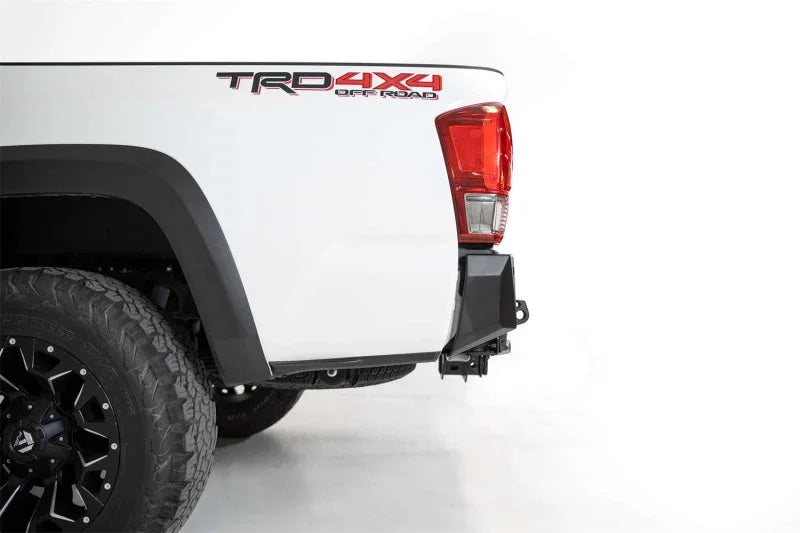 Addictive Desert Designs 16-19 Toyota Tacoma Stealth Fighter Rear Bumper w/ Backup Sensor Cutouts - Side View