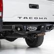 Load image into Gallery viewer, Addictive Desert Designs 16-19 Toyota Tacoma Stealth Fighter Rear Bumper w/ Backup Sensor Cutouts - Back View