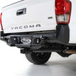 Load image into Gallery viewer, Addictive Desert Designs 16-19 Toyota Tacoma Stealth Fighter Rear Bumper w/ Backup Sensor Cutouts - Installation View