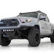 Load image into Gallery viewer, Addictive Desert Designs 16-20 Toyota Tacoma PRO Bolt-On Front Bumper - Hammer Black - Installation View