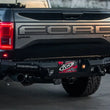 Load image into Gallery viewer, Addictive Desert Designs 17-18 Ford F-150 Raptor HoneyBadger Rear Bumper w/ 10in SR LED Mounts - Main Product View