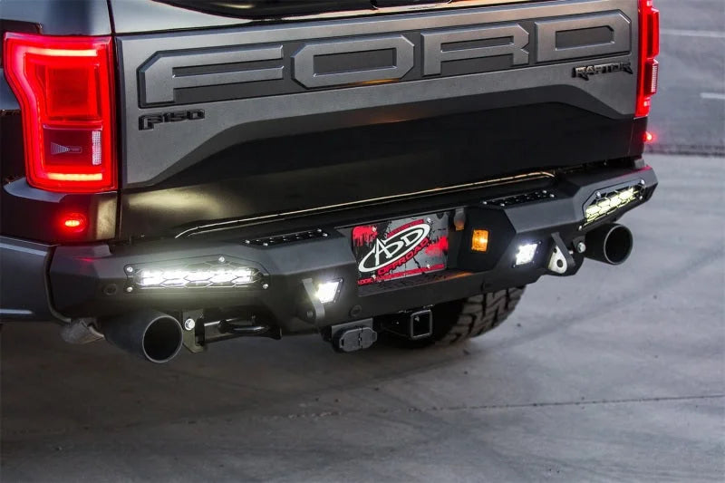 Addictive Desert Designs 17-18 Ford F-150 Raptor HoneyBadger Rear Bumper w/ 10in SR LED Mounts - Installation View