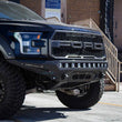 Load image into Gallery viewer, Addictive Desert Designs 17-18 Ford F-150 Raptor Stealth Fighter Front Bumper - Side View