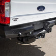Load image into Gallery viewer, Addictive Desert Designs 17-18 Ford F-250 Raptor Stealth Fighter Rear Bumper w/ Backup Sensor Cutout - Installation View