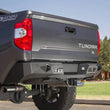 Load image into Gallery viewer, Addictive Desert Designs 2014+ Toyota Tundra Stealth Fighter Rear Bumper w/ Backup Sensor Cutouts - Main Product View