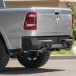 Load image into Gallery viewer, Addictive Desert Designs 2019 Ram 1500 Hammer Stealth Fighter Rear Bumper w/ 6 Sensor Cutouts - Main Product View