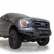Load image into Gallery viewer, Addictive Desert Designs 2021 Ford F-150 HoneyBadger Front Bumper w/ Top Hoop - Installation View
