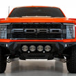 Load image into Gallery viewer, Addictive Desert Designs 2021+ Ford Raptor Bomber Front Bumper w/ 4 Rigid 360 6in Light Mounts - Side View