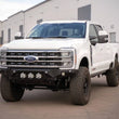 Load image into Gallery viewer, Addictive Desert Designs 2023+ Ford F-250/F-350 Bomber Front Bumper (w/ 3 Baja Designs LP6 Mounts) - Back View