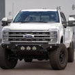 Load image into Gallery viewer, Addictive Desert Designs 2023+ Ford F-250/F-350 Bomber Front Bumper (w/ 3 Baja Designs LP6 Mounts) - Installation View