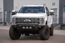 Load image into Gallery viewer, Addictive Desert Designs 2023+ Ford F-250/F-350 Bomber Front Bumper (w/ 3 Baja Designs LP6 Mounts) - Installation View
