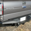 Load image into Gallery viewer, Addictive Desert Designs HoneyBadger Rear Bumper w/ Tow Hooks fits 2010-2014 Ford F-150 Raptor, F-150 SVT Raptor, F-150 FX...