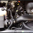 Load image into Gallery viewer, Airaid 99-04 Chevy / GMC / Cadillac 4.8/5.3/6.0L Airaid Jr Intake Kit - Dry / Red Media - Main Product View