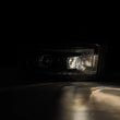 Load image into Gallery viewer, AlphaRex 02-05 Dodge Ram 1500 LUXX LED Proj Headlights Plank Style Black w/Activ Light/Seq Signal - Installation View