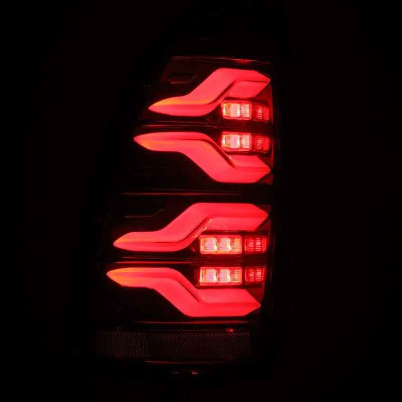 AlphaRex 05-15 Toyota Tacoma LUXX LED Taillights Alpha Blk w/Activ Light/Seq Signal - Back View