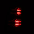 Load image into Gallery viewer, AlphaRex 05-15 Toyota Tacoma LUXX LED Taillights Alpha Blk w/Activ Light/Seq Signal - Additional View 5